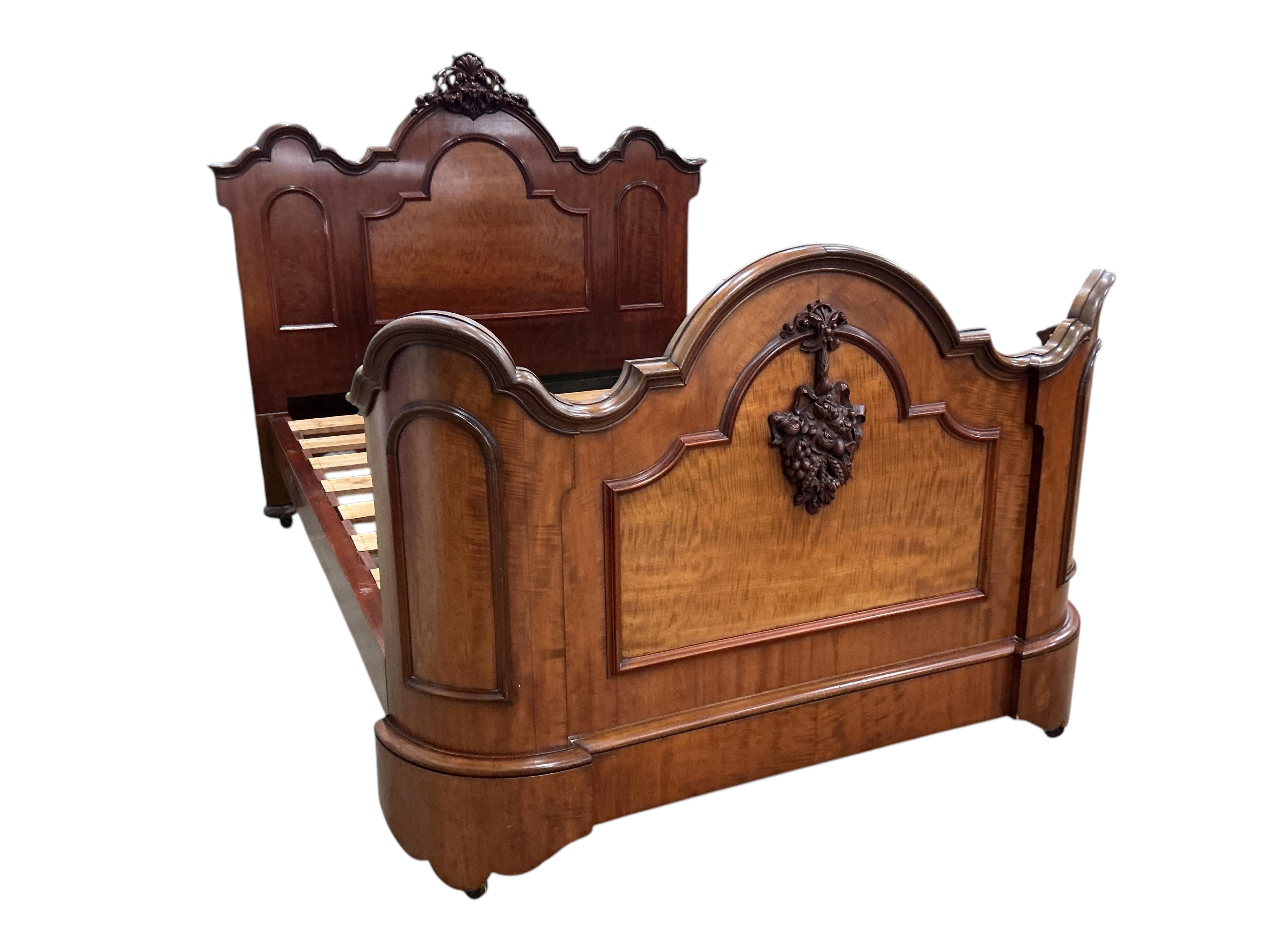 A Victorian carved mahogany double bed frame, width 154cm, height 156cm